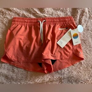 NWT Vuori shorts in “Clementine.”